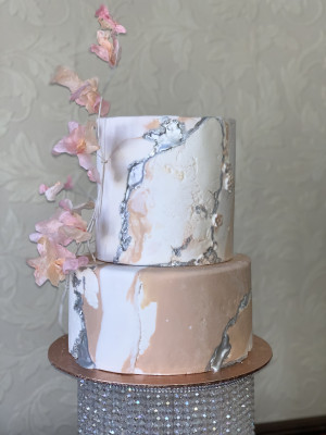 Marble stone cake with wafer abstract flowers